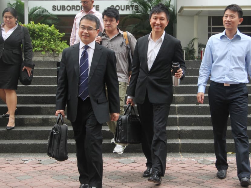 One of the accused, Kong Hee (2nd right), leaving the Subordinate Courts with his legal team and church members after testifying in the City Harvest trial on Jan 17, 2014. Photo: Don Wong
