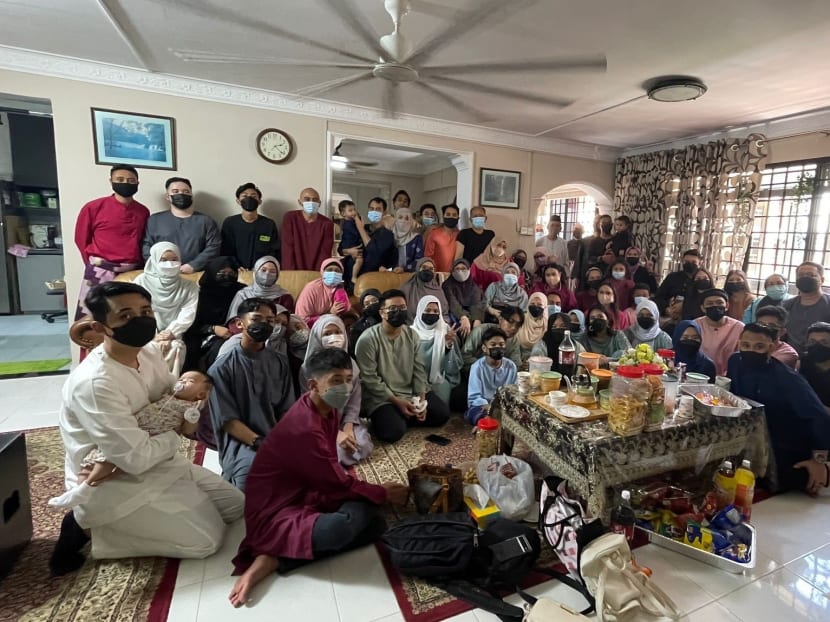 Mr Muhammad Ridhwan Ismail Johari, 28, (top left, in red) with his family and relatives gathering at his granduncle’s Kaki Bukit home for Hari Raya Puasa on May 3, 2022. 