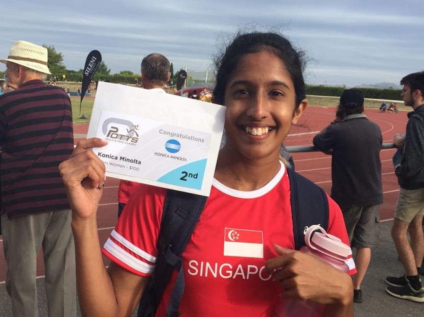 Shanti Pereira showing off her certificate for winning silver. She has qualified for this August's SEA Games in Kuala Lumpur with her time of 11.78sec. Photo: Margaret Oh.