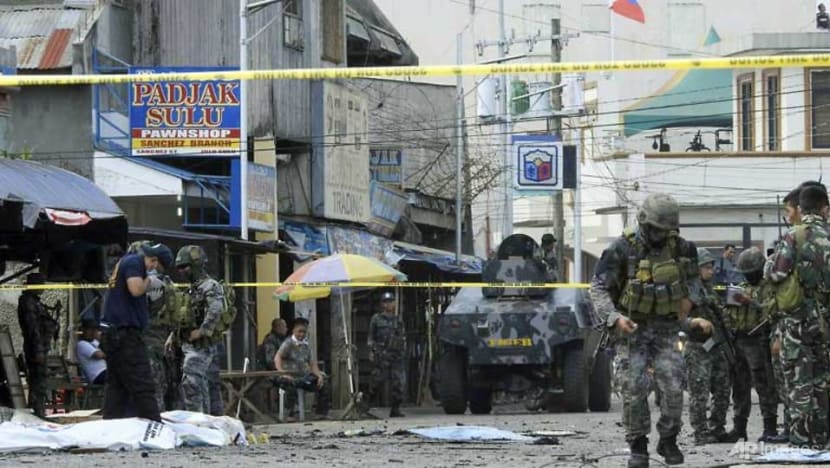 Twin bomb attacks on Philippine church kill at least 18