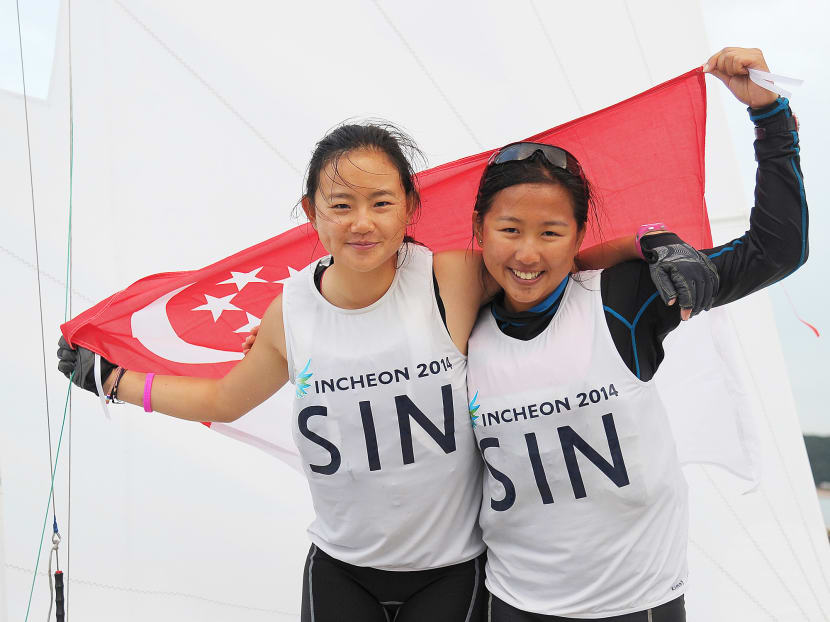Savannah Siew (left) and Kimberly Lim ended their partnership on a high, winning gold in the women’s 420. Photo: SNOC