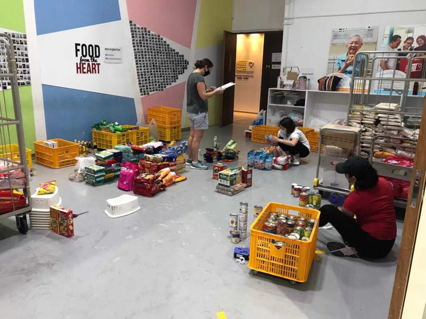 Volunteers at Food from the Heart's packing facility in Joo Seng Road. Volunteers at Food from the Heart's packing facility in Joo Seng Road.