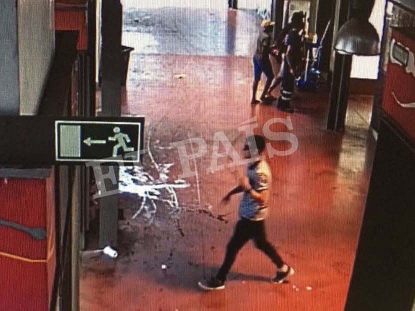 In this watermarked frame grab from CCTV released by the Spanish newspaper El Pais on Monday (Aug 21), a suspect believed to be Younes Abouyaaqoub is captured by a security camera walking through La Boqueria market seconds after a van crashed into pedestrians in Barcelona last August 17. Photo: AP