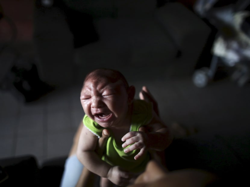Daniele Santos, 29, holds her son Juan Pedro who is 2-months old and born with microcephaly, at their house in Recife, Brazil, February 9, 2016. Photo: Reuters