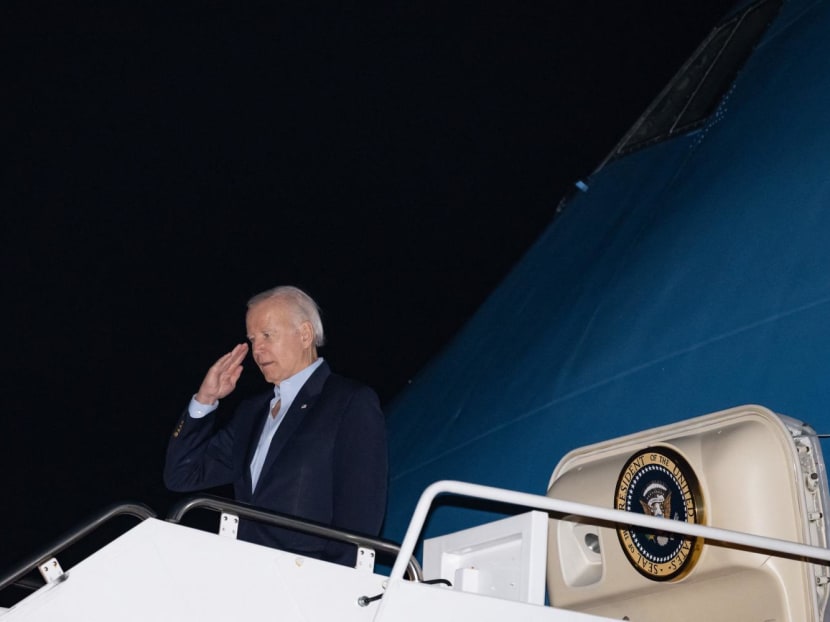United States President Joe Biden salutes as he boards Air Force One at Joint Base Andrews in Maryland on Nov 10, 2022. Biden is travelling to Phnom Penh, Cambodia, and Bali, Indonesia, to participate in the ASEAN and G20 suummits.
