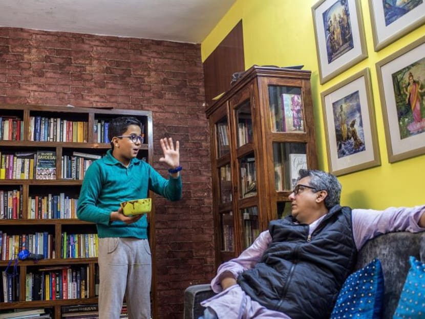 (Right) Mr Rahul Verma spends time with his son Uday, who was born gravely ill with digestive problems, at their home in New Delhi on Nov 24, 2017. PHOTO: THE NEW YORK TIMES