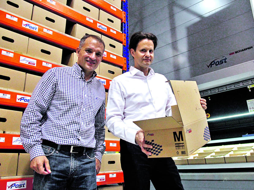 SP eCommerce CEO Marcelo Wessler (left) and SingPost group CEO Wolfgang Baier. SingPost started SP eCommerce two years ago to provide one-stop, end-to-end e-commerce solutions. Photo: Tristan Loh
