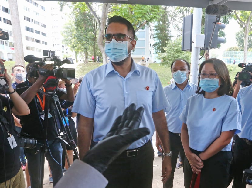 The Committee of Privileges recommended in its report that opposition leader Pritam Singh (centre) and fellow Member of Parliament Faisal Manap (second from right) be referred to the public prosecutor for further investigation.