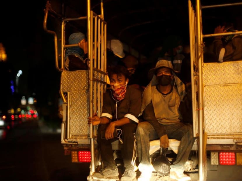 Migrant construction workers are transported in a truck amid the coronavirus disease outbreak, in Bangkok.