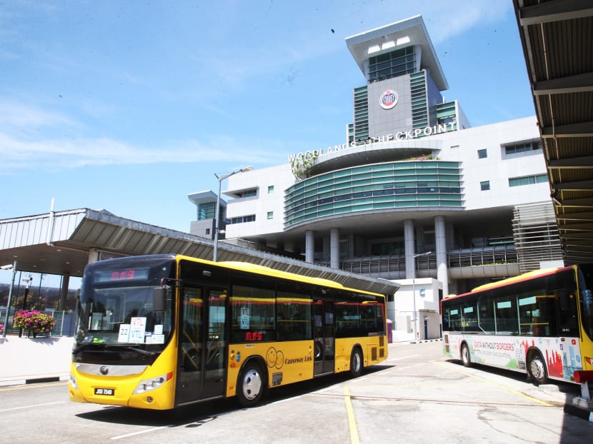 A bus operated by Causeway Link travel agency under the vaccinated travel lane scheme, leaving Woodlands Checkpoint in Singapore.