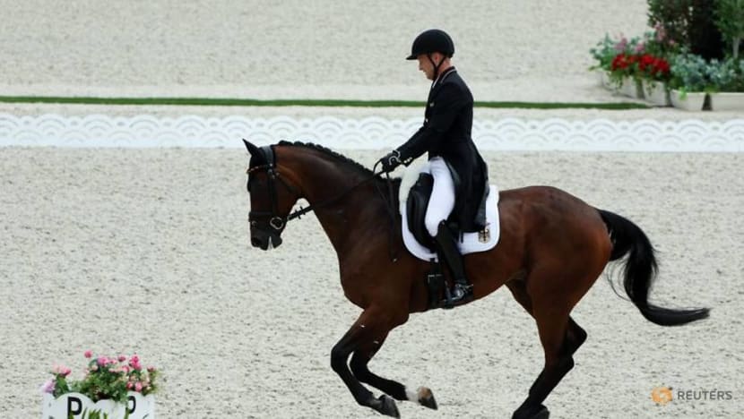Olympics-Equestrian-German birthday boy Michael Jung takes eventing lead