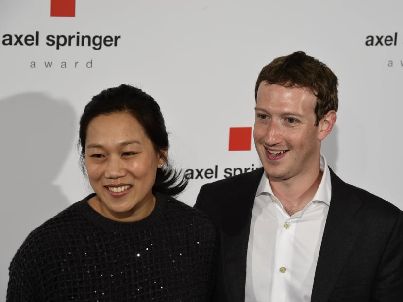 File photo of Facebook founder and CEO Mark Zuckerberg (R) with his wife Priscilla Chan. Photo: AFP