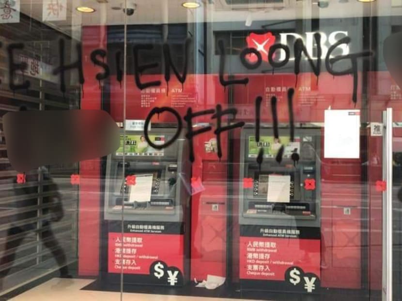 A photograph circulating on social media of graffiti at a DBS Bank branch in Hong Kong. TODAY has blurred out vulgarities. DBS said on Thursday the graffiti had been removed.