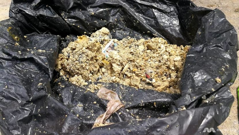 All in a day's work: Digging out condoms, hardened grease and rags from the sewers All in a day's work: Digging out condoms, hardened grease and rags from the sewers