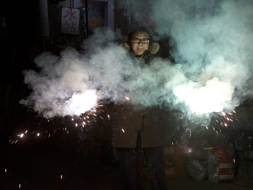 Gallery: China marks Lunar New Year with prayers, incense, fireworks