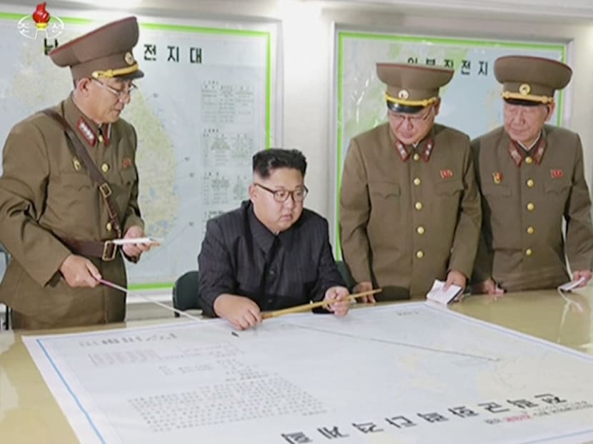 In this file image made from video of an Aug 14, 2017, broadcast in a news bulletin by North Korea's KRT,  North Korean leader Kim Jong Un receives a military briefing in Pyongyang. Conventional wisdom says that if North Korea were ever to use its nuclear weapons, it would be an act of suicide. Photo: AP