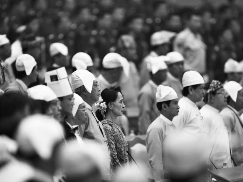 Ms Aung San Suu Kyi (centre) and Myanmar’s newly elected President Htin Kyaw (to her right) attending a ceremony in Myanmar’s Parliament. The Myanmar people and the international community will be looking to the NLD government to prove that it can hit the ground running and deliver results. Photo: AP