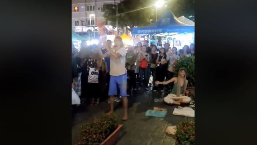 Malaysian police detain busking couple 'abusing' baby Malaysian police detain busking couple 'abusing' baby