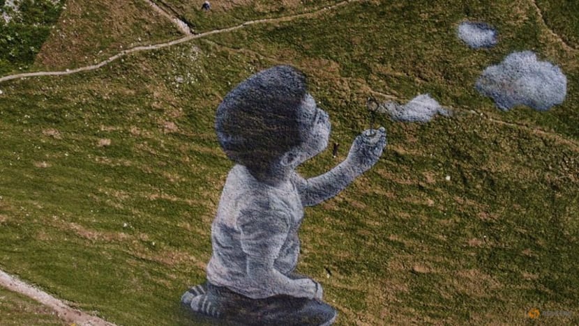 Graffiti artist captures lightness of clouds to lift spirits Graffiti artist captures lightness of clouds to lift spirits