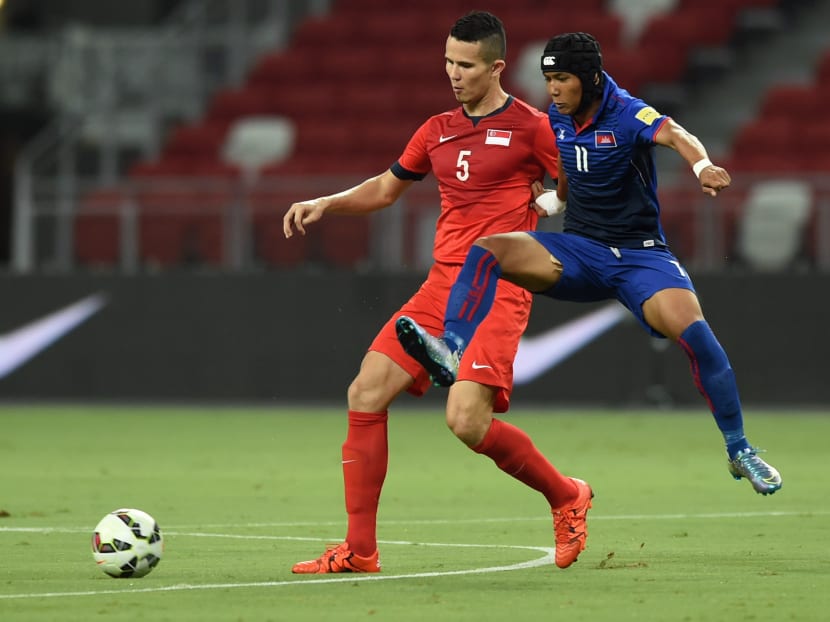 Chan Vathanaka (right), seen here in action for his country against Singapore's Baihakki Khaizan, is the first Cambodian to join the J-League. He has been signed on loan until the end of 2017 from Cambodia's Boeung Ket Angkor, where he scored a prolific 90 goals in 116 appearances. Photo: AFP