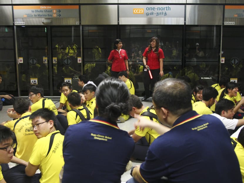 Anglo-Chinese School (Independent) students waiting for a chartered train at one-north Station on Tuesday. PHOTO: DON WONG