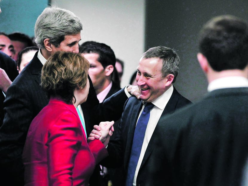 Ukrainian Foreign Minister Andriy Deshchytsia (right) thanking US Secretary of State John Kerry and EU High Representative Catherine Ashton for the results of a quadrilateral meeting on Thursday. Photo: Reuters