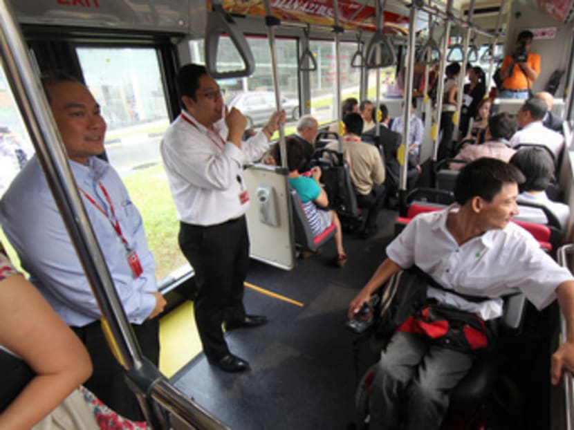 A wheelchair-bound man onboard an SMRT bus. TODAY file photo
