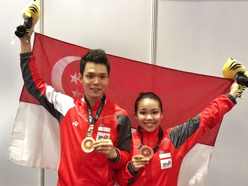 Fung siblings Jin Jie and Hui Xin showing off their bronze medals. Photo: Chan Keng Ngee