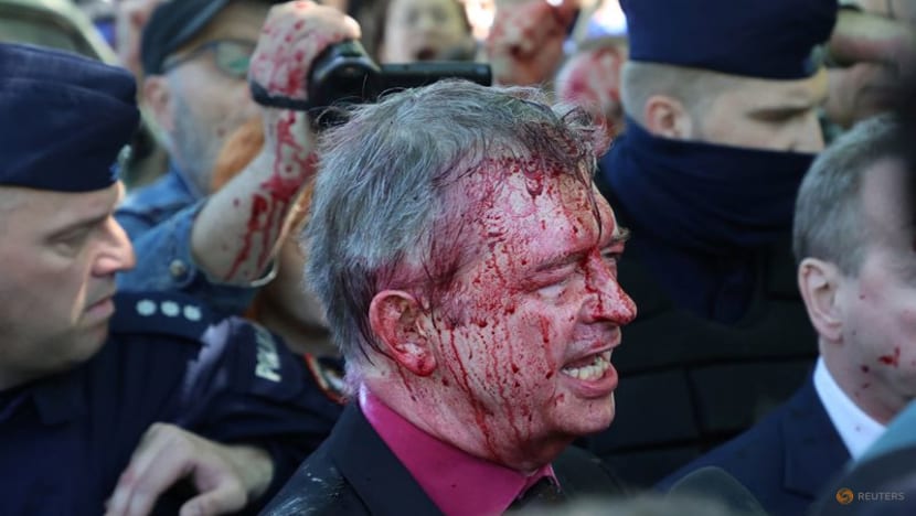 Russian envoy to Poland doused in red by anti-war protesters Russian envoy to Poland doused in red by anti-war protesters