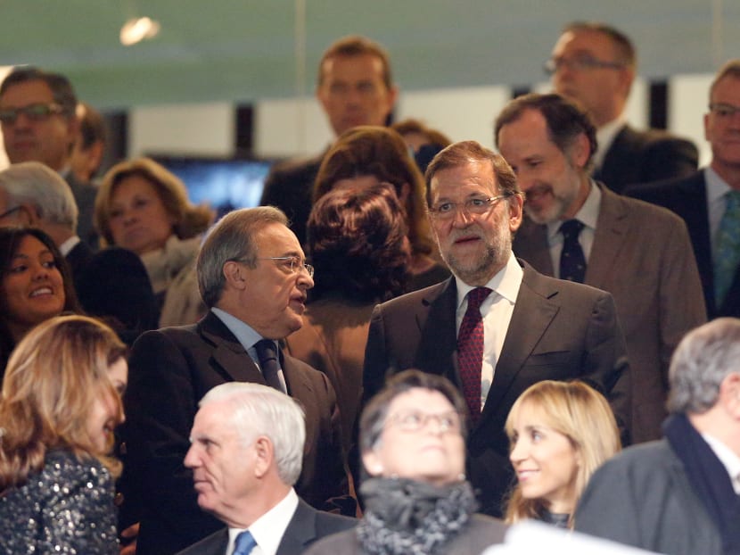 Real Madrid's presidente Florentino Perez, center left, talks with Spanish Prime Minister Mariano Rajoy before the first clasico of the season between Real Madrid and Barcelona at the Santiago Bernabeu stadium in Madrid, Spain. Photo: AP