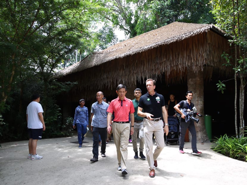Trade and Industry Minister Chan Chun Sing speaking to staff at the Singapore Zoo to learn about their precautionary measures for Covid-19.
