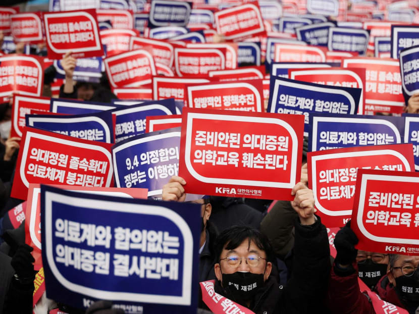 Doctors chant slogans during a rally to protest against government plans to increase medical school admissions in Seoul, South Korea on March 3, 2024.