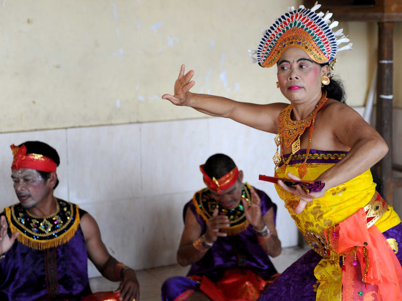 Deaf people performing a traditional dance at Bengkala village, where it is home to an unusually large number of deaf people for generations, with about 40 out of 3,000 residents having severe hearing loss. Photo: AFP
