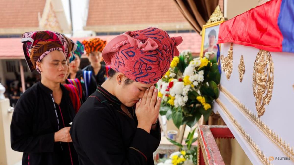 Thai mall shooting victim's mother bids emotional farewell at cremation
