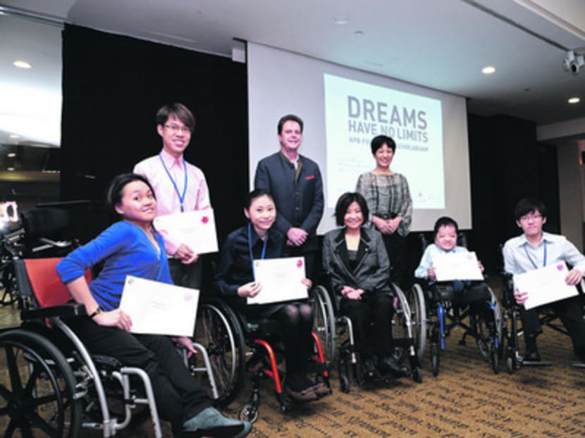 (Back row, from left) Scholarship awardee George Lim, APB CEO Roland Pirmez and Senior Minister of State (Law and Education) Indranee Rajah. (Front row, from left) Ms Jacqueline Woo, 
Ms Amanda Chan, SPD President Chia Yong Yong, Mr Seah Wei Jian and Mr Ong Hua Han. Photo: Society For The Physically Disabled