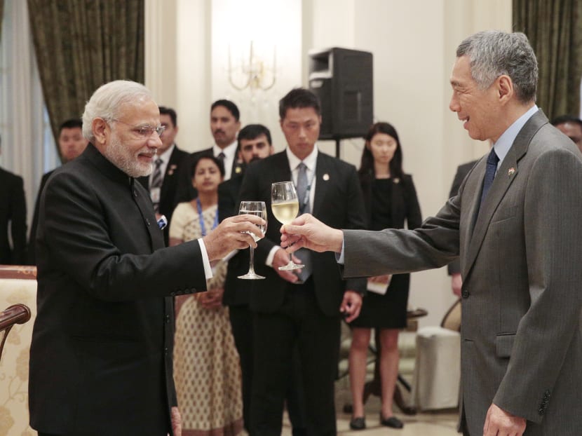 Prime Minister Lee Hsien Loong with Indian Prime Minister Narendra Modi at the Istana today (Nov 24). The two leaders signed bilateral documents on defence, aviation, culture, urban governance, security and capacity-building. Photo: Jason Quah/TODAY