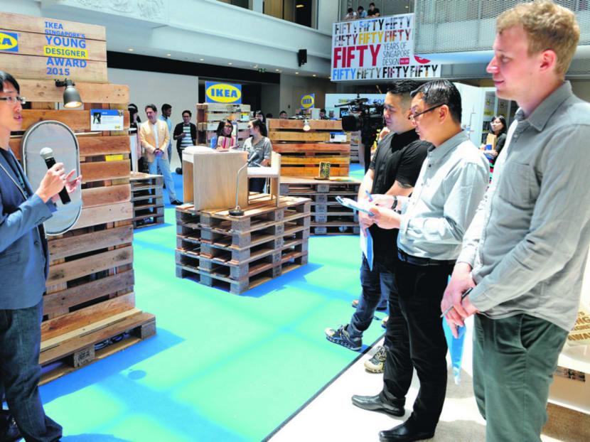 Eventual winner Duane Lye explaining his concept to judges which includes Ikea designer David Wahl and Jeffrey Ho, Executive Director of DesignSingapore Council