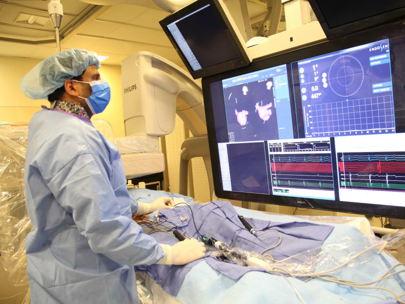 In this undated image provided on Saturday Aug. 29, 2015  by Mount Sinai Hospital in New York shows Dr Vivek Reddy as he checks the screen  while doing a surgery to implant the new tiny  wireless pacemaker at the Mount Sinai hospital in New York. Photo: Mount Sinai Hospital via AP