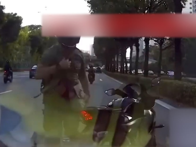 A screengrab of the motorcyclist caught on video claiming to be from the military police. 