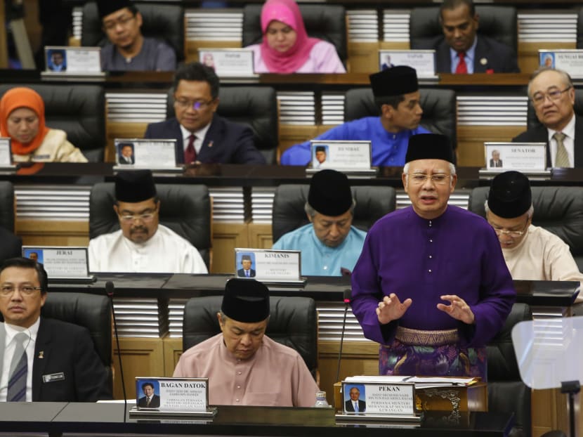 Malaysian Prime Minister and Finance Minister Najib Razak, front row right, speaks as he unveils the Malaysia's 2016 budget at Parliament House in Kuala Lumpur, Malaysia, Friday, Oct. 23, 2015. Photo: AP