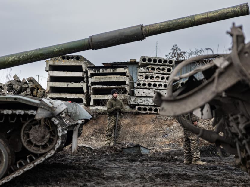A Ukrainian serviceman stands next to tanks in an undisclosed location in eastern Ukraine on Dec 29, 2022, amid Russian invasion of Ukraine.
