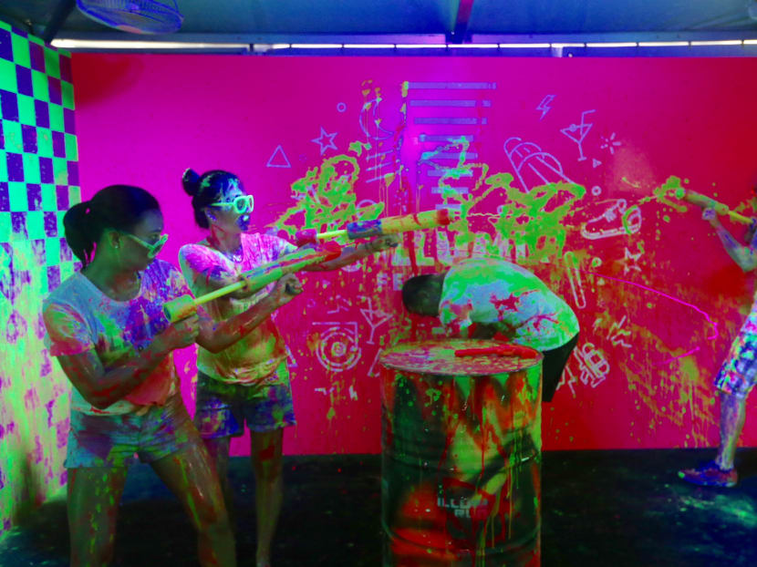 Photo of the day: Participants are seen dousing each other with “Glow Water” at the ILLUMI FEST RUN 2018, which is one of the activities that was introduced during the i Light Marina Bay Media Conference on Tuesday (Feb 6). The ILLUMI FEST RUN 2018 will be held on March 31. Photo: Koh Mui Fong/TODAY
