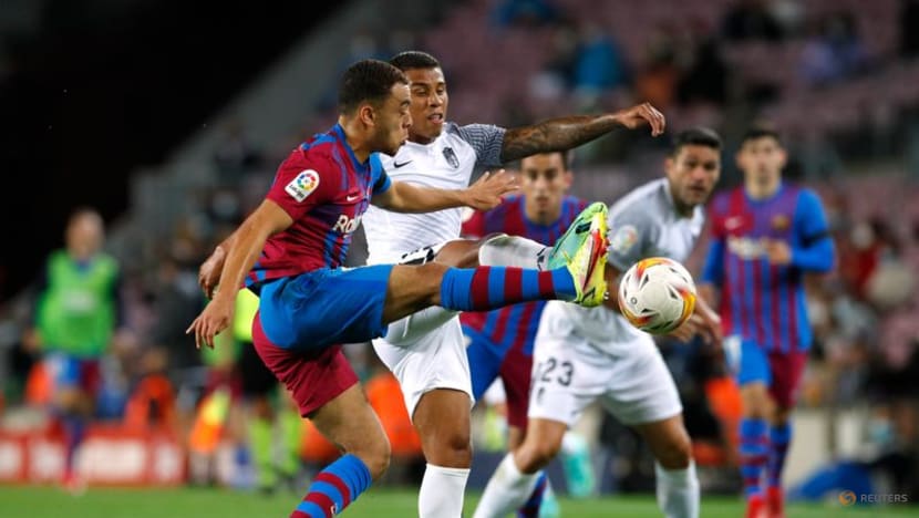 Football: Barca scrape late draw with Granada as fans stay away Football: Barca scrape late draw with Granada as fans stay away
