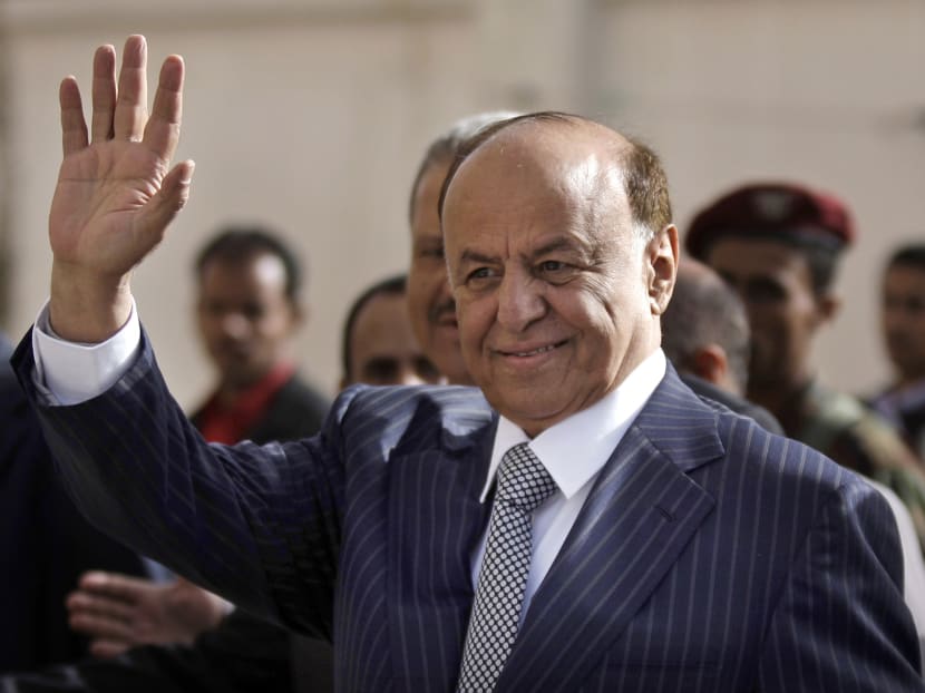 Yemen's President Abed Rabbo Mansour Hadi gestures as he enters a polling center to cast his vote in Sanaa. Photo: AP