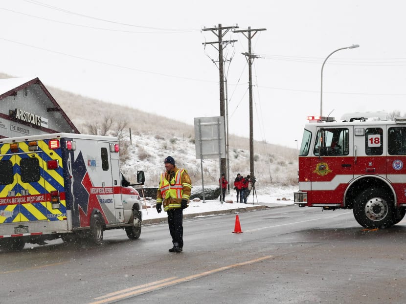 An ambulance proceeds up a secure on a road leading to a Planned Parenthood center after reports of an active shooter in Colorado Springs, Colordo.  Photo: REUTERS/Isaiah J Downing