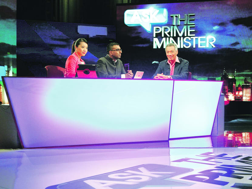 PM Lee Hsien Loong during a LIVE recording of Ask The Prime Minister with hosts CNA Presenter Sharon Tong (left) and Editor-in-Chief Walter Fernandez (right) at the MediaCorp TV theatre. Photo: Don Wong