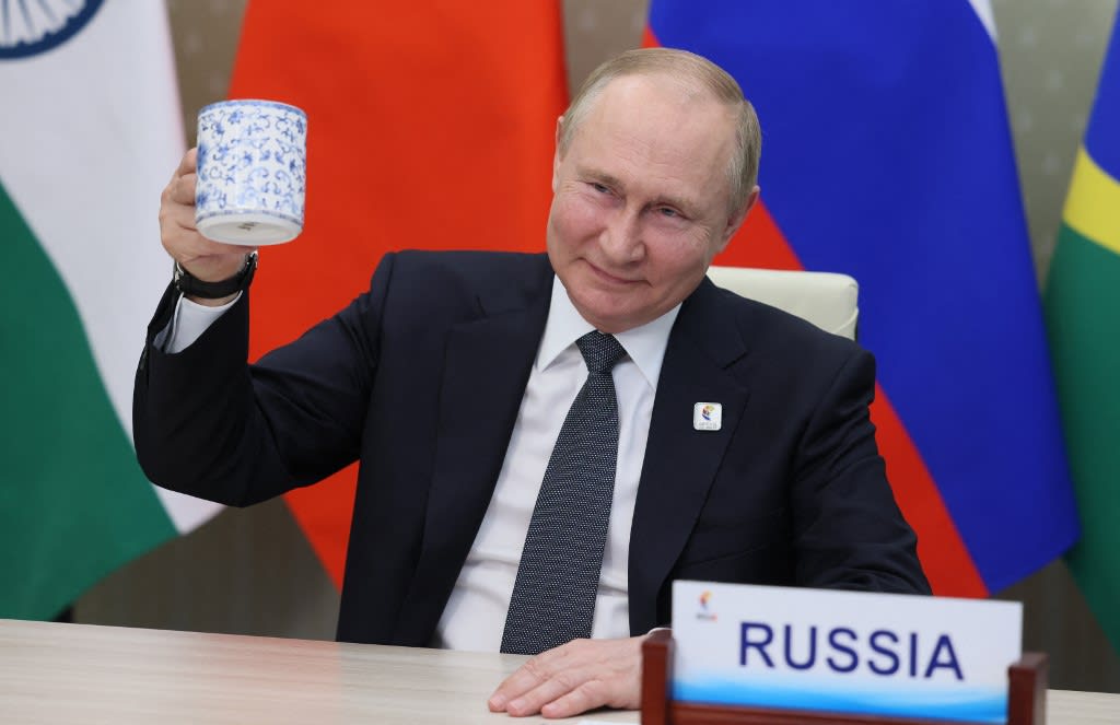 Russian president Vladimir Putin makes a toast as he takes part in the XIV BRICS summit in virtual format via a video call, in Moscow on June 23, 2022. Russian president Vladimir Putin makes a toast as he takes part in the XIV BRICS summit in virtual format via a video call, in Moscow on June 23, 2022.