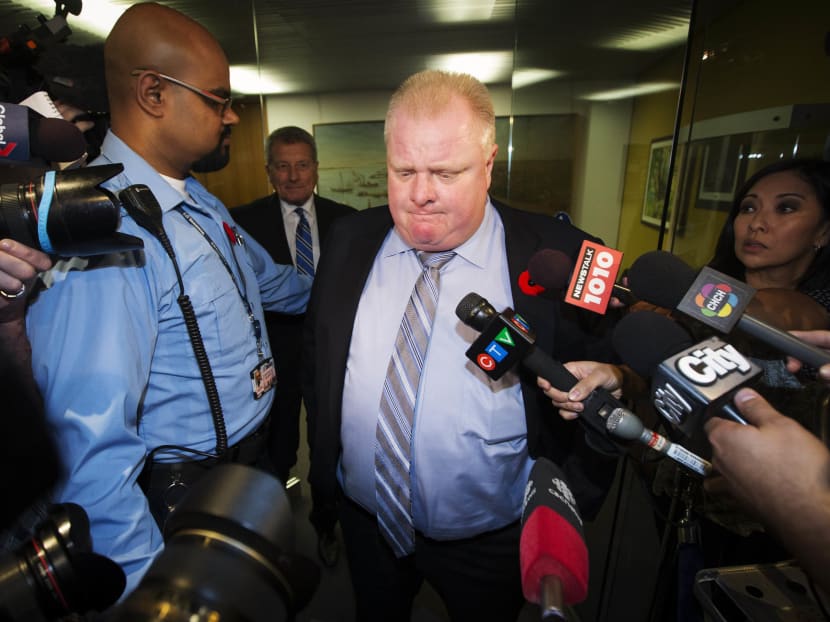 Toronto Mayor Rob Ford (centre) reacts to a video released of him by local media at City Hall in Toronto on Nov 7, 2013. Photo: Reuters