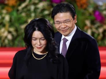 Deputy Prime Minister and Minister of Finance Lawrence Wong arriving at the Istana with his wife on the day he was to be sworn in as Singapore's new prime minister on May 15, 2024. 