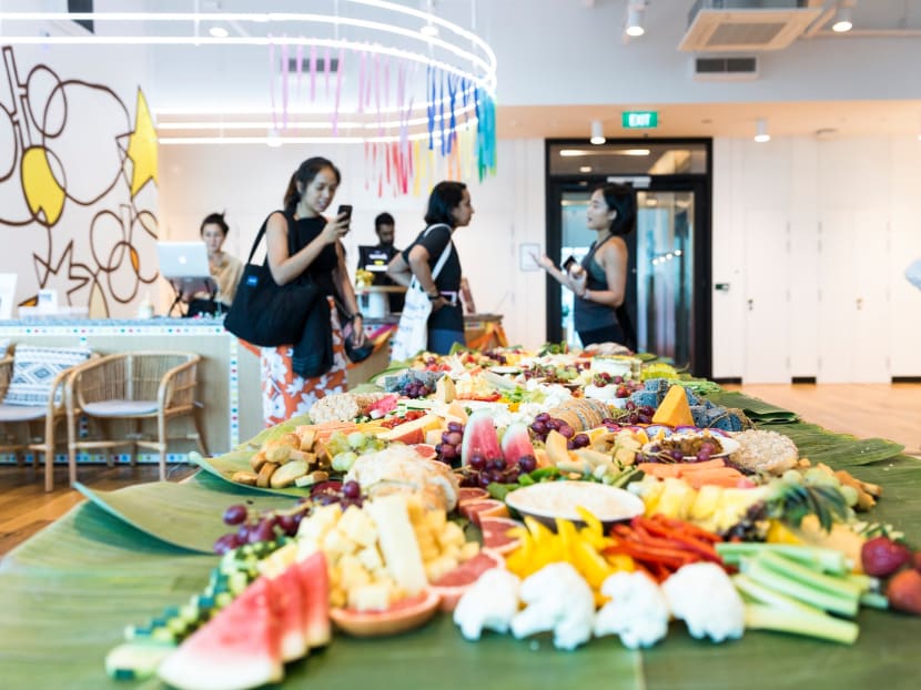 A WeWork office at Jalan Besar in Singapore. The rapid rise of WeWork has fed into wider trends in contemporary office design: Desk-sharing, open-plan, higher density and a blending of work with relaxation. A WeWork office at Jalan Besar in Singapore. The rapid rise of WeWork has fed into wider trends in contemporary office design: Desk-sharing, open-plan, higher density and a blending of work with relaxation.